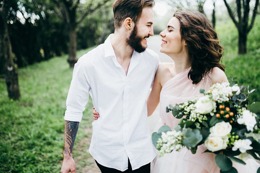 Loves and very happy groom and bride in the park