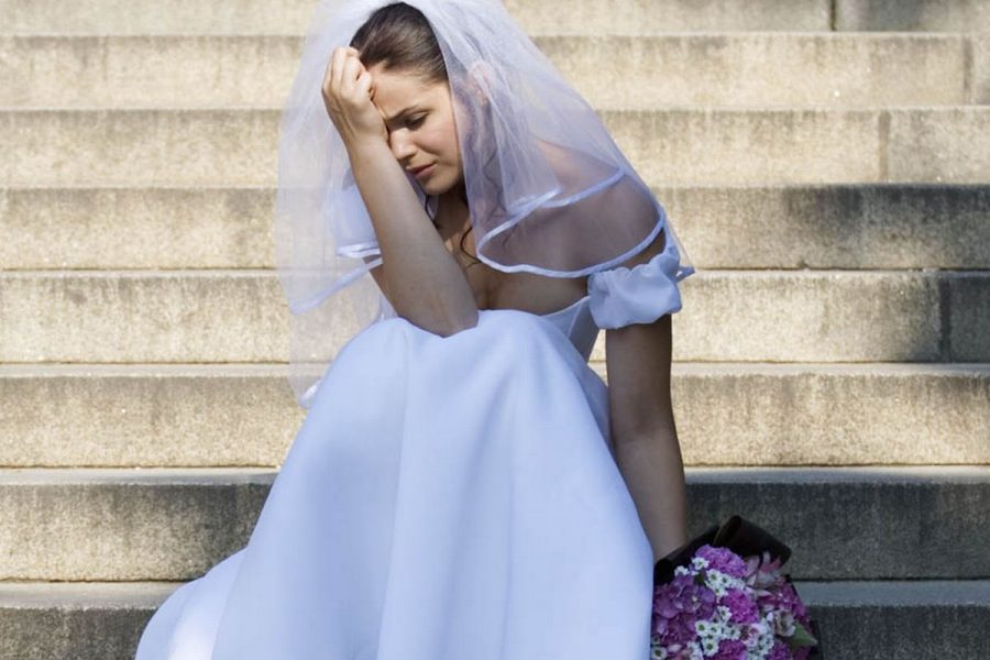 3_A-bride-sitting-on-steps-looking-sad 3_A-bride-sitting-on-steps-looking-sad